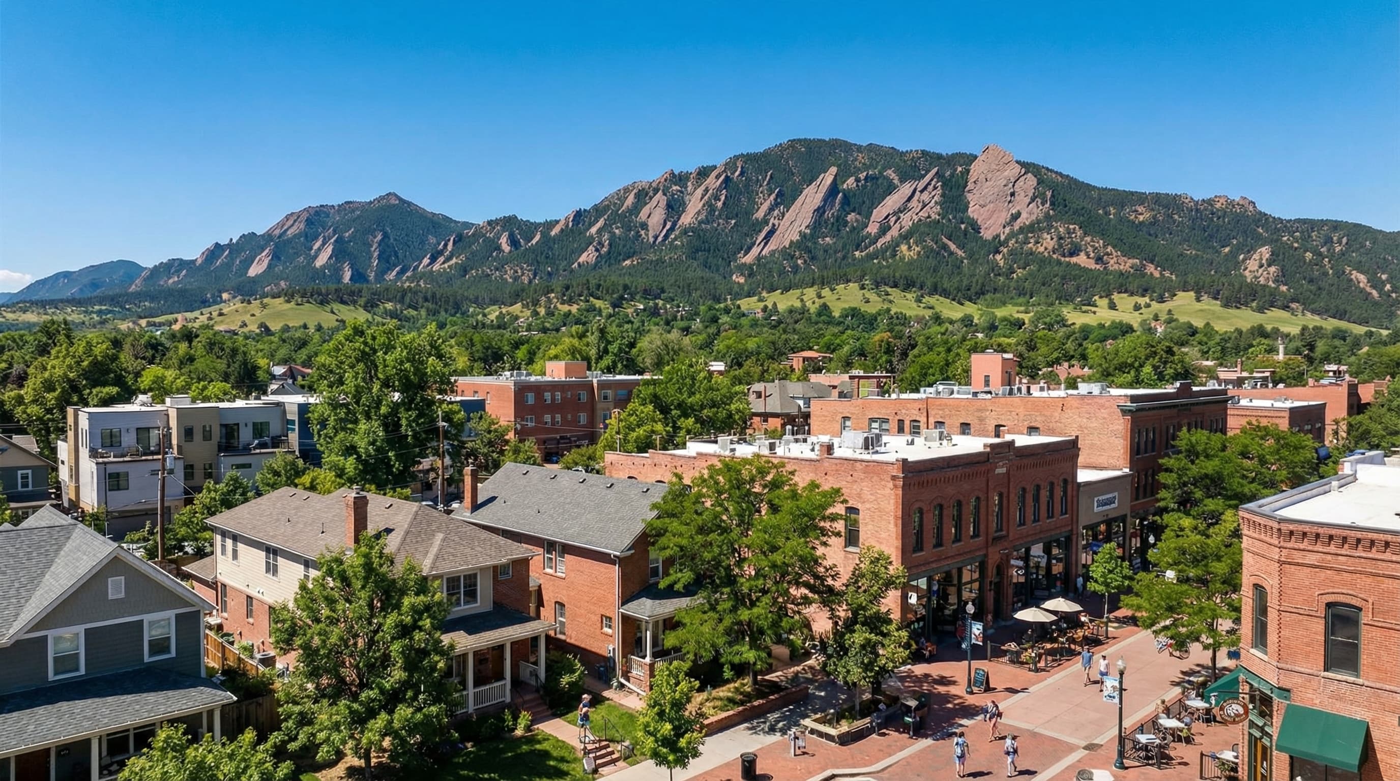 Boulder Colorado with dramatic Flatirons rock formations backdrop, Pearl Street pedestrian mall, and colorful fall foliage
