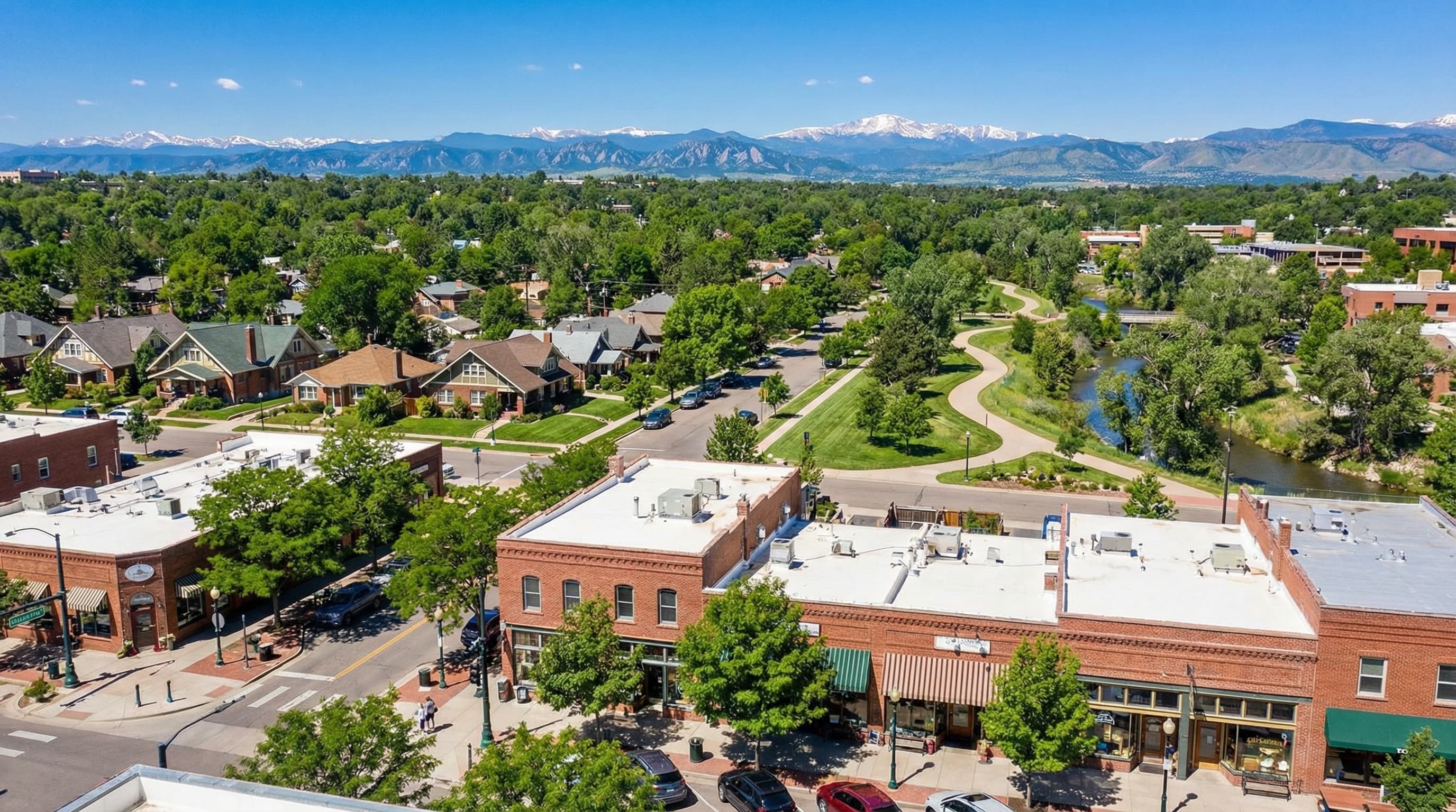 Historic downtown Littleton Colorado with Main Street shops, Platte River, and foothill backdrop