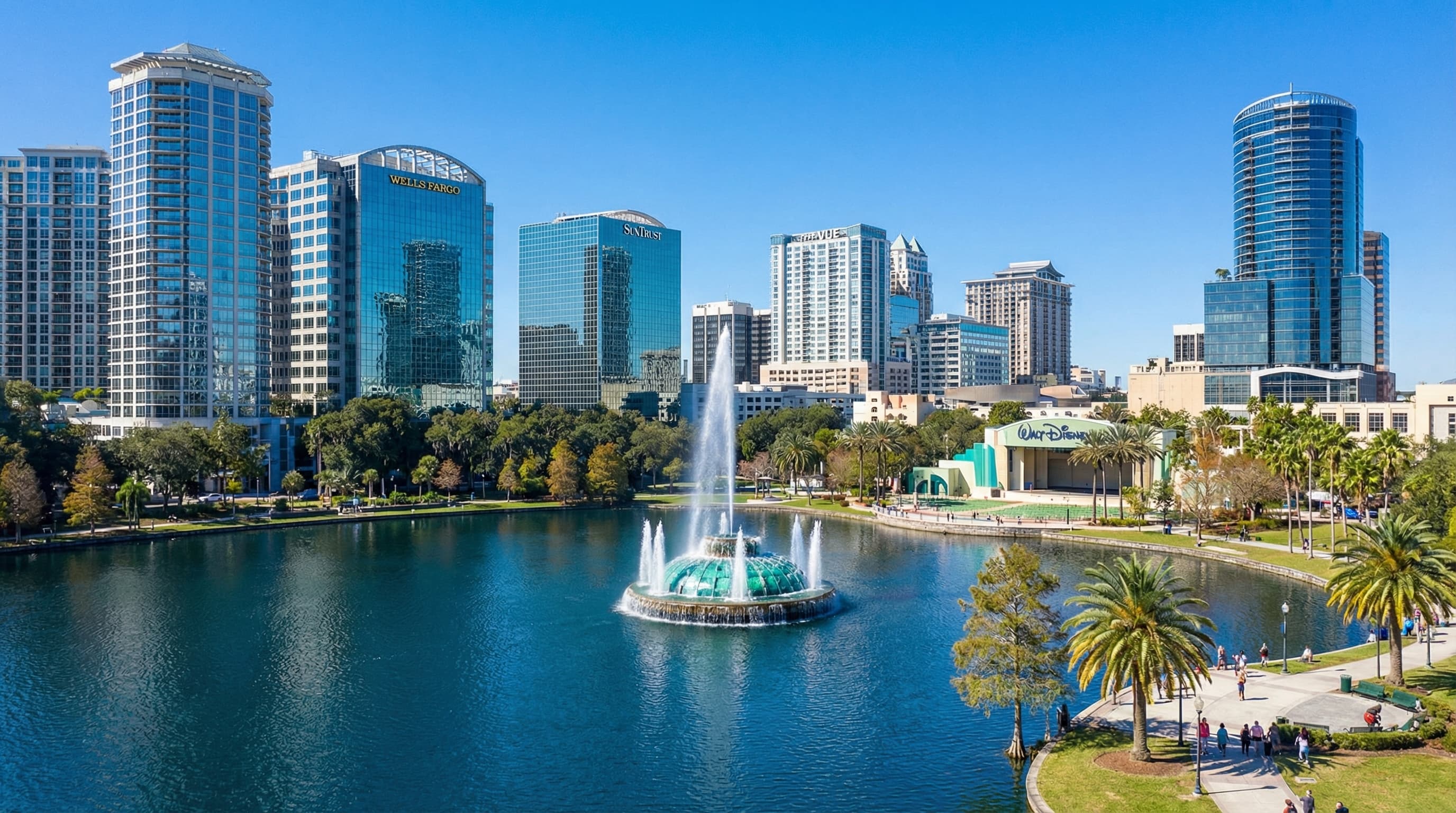 Orlando Florida skyline at sunset with Lake Eola and downtown buildings reflecting on water