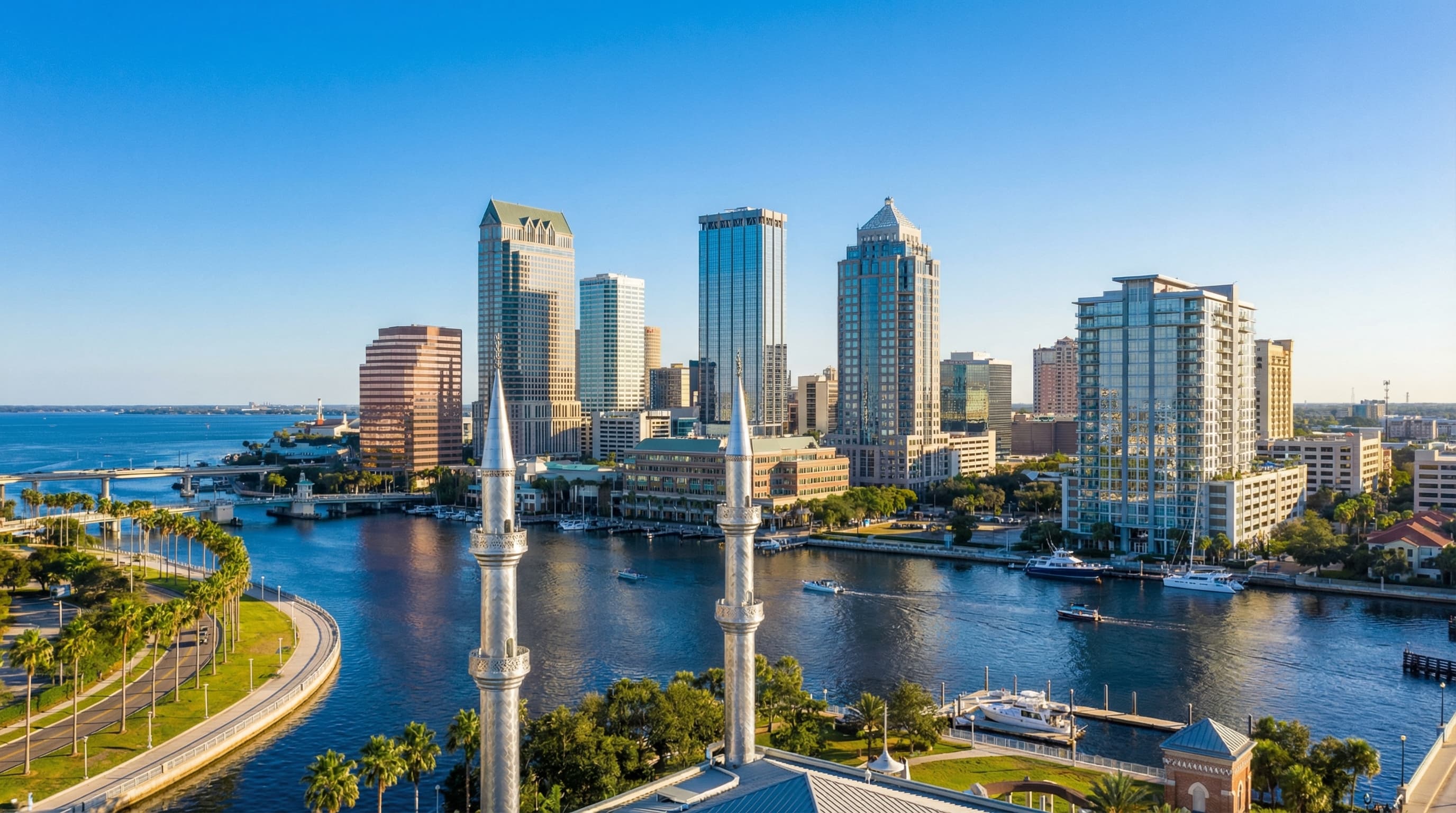 Tampa Florida downtown skyline with Bayshore Boulevard, Tampa Bay waterfront, and South Tampa at sunset
