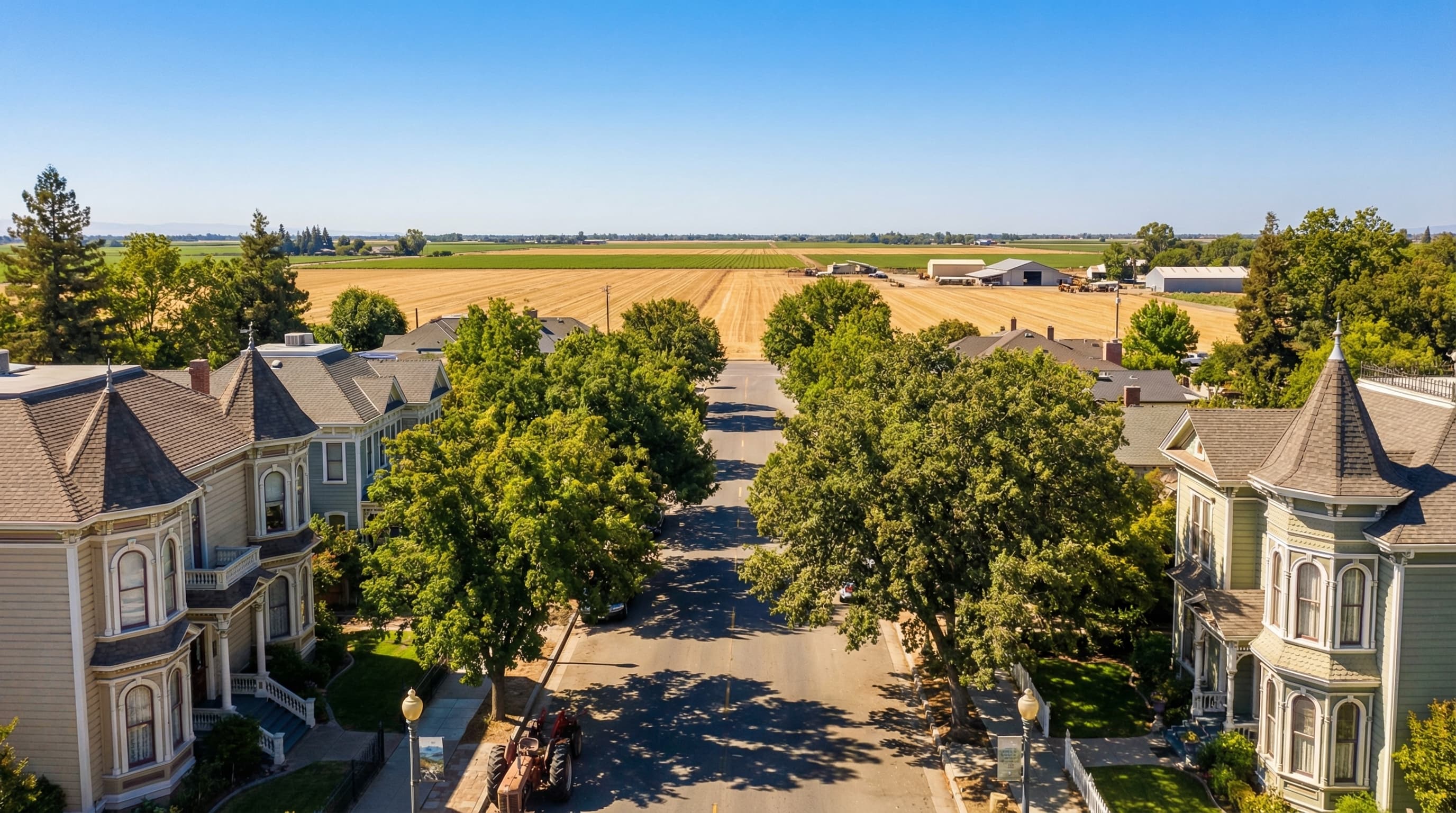 Historic Woodland California agricultural community with Victorian homes in downtown, tree-lined streets, and agricultural heritage on a bright sunny California day